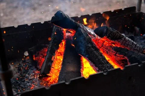 Firewood in brazier Stock Photos