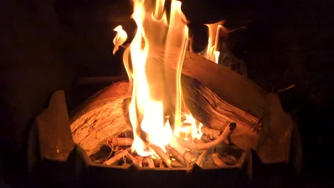 Firewood burning in the fireplace in slow motion Stock Footage 142960372