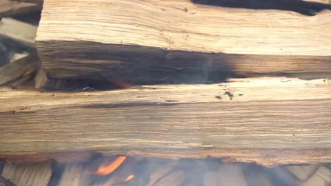 Firewood is burning in the grill Видео 74679623