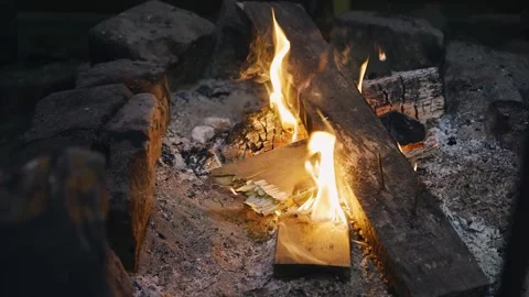 Firewood is burning in an open fireplace, warming the surrounding space Stock Footage 257058860