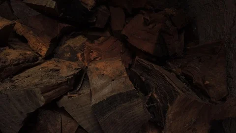 Firewood. The camera moves. It becomes visible warehouse firewood. Video stock 116565188