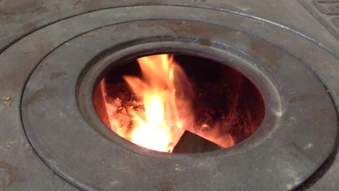 Firewood Flame of Fire Actively burning in the Round Circle of a Stove Hole 1 Stock Footage 167971050