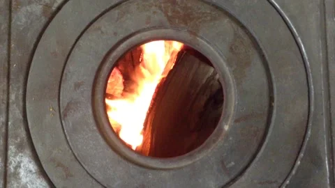Firewood Flame of Fire Actively burning in the Round Circle of a Stove Hole 0 Stock Footage 167971052
