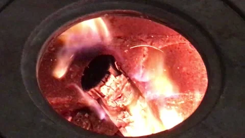Firewood Flame of Fire Actively burning in the Round Circle of a Stove Hole 3 Stock Footage 168013995