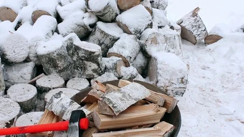 Firewood split and lie along with a cleaver Stock Footage 70433532
