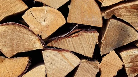 Firewood, split wood stacked, moving sideways, close-up macro. Stock Footage 166697094