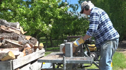 Firewood splitting machine and operator HD Stock Footage 43177906
