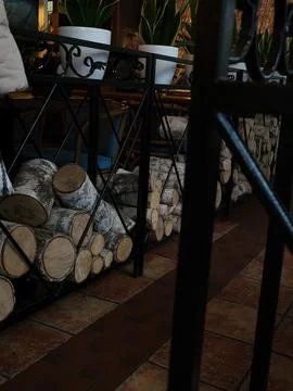 Firewood stack in restaurant interior Stock Photos
