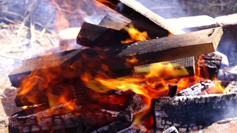 Firewood, stacked fire burning in the fire outdoors hd Видео 331655467