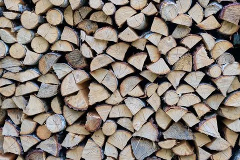 Firewood stacked for storage. Seamless pattern, texture or background Stock Photos