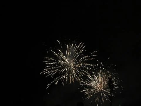 Firework blasts on a black sky Stock Photos