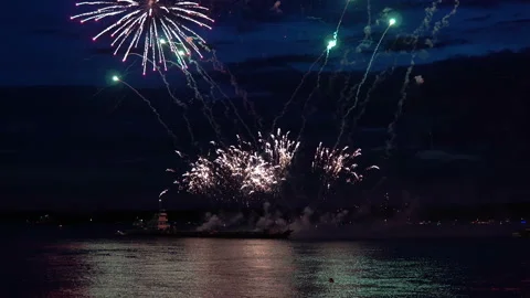 Firework from boat on evening sky Stock Footage 90932904