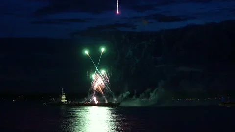Firework from boat on evening sky Stock Footage 90933210