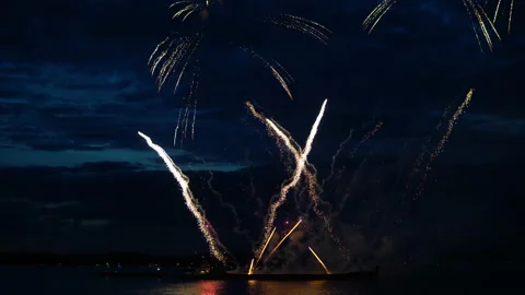 Firework from boat on evening sky Stock Footage 91100337