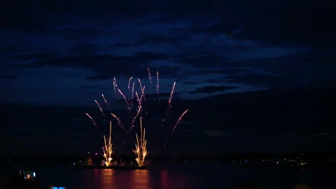 Firework from boat on evening sky Stock Footage 91100967
