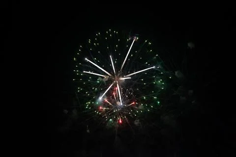 Firework display against black night sky with artistic noise and blur Stock Photos