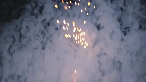 Firework display lights up the night sky in a vibrant celebration of color and s Stock Footage 297458468