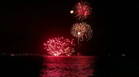 Firework display over the sea reflections on the water sandbanks Stock Footage 8506502