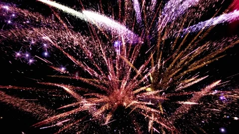 Firework display in slow motion. Bokeh Particles and Sparks On Night Sky Stock Footage 97941449