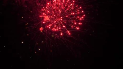 Firework exploding crowns with shimmering traces and sparks in black sky 스톡 사진