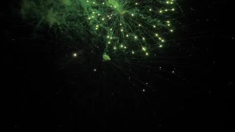Firework exploding crowns with shimmering traces and sparks in black sky Foto stock