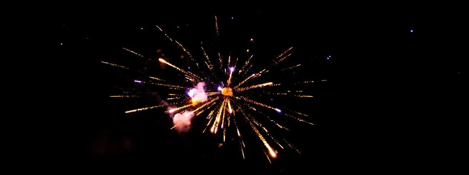 Firework exploding in the dark night sky to celebrate the new year. Colorful  Stock-Fotos