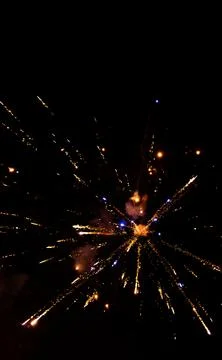 Firework exploding in the dark night sky to celebrate the new year. Colorful  Stock Photos