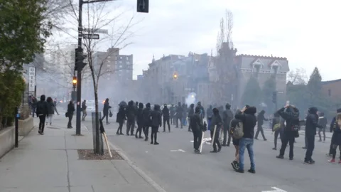 Firework exploding during a violent protest in the city Stock Footage 89522567