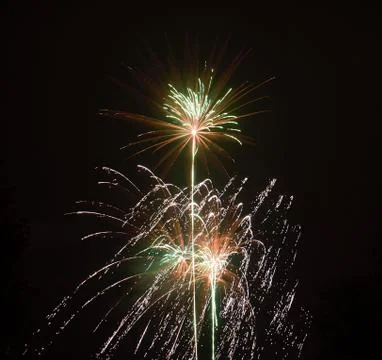 Firework exploding, in the night sky Stock Photos