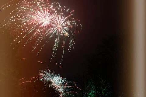 Firework exploding, in the night sky Stock Photos