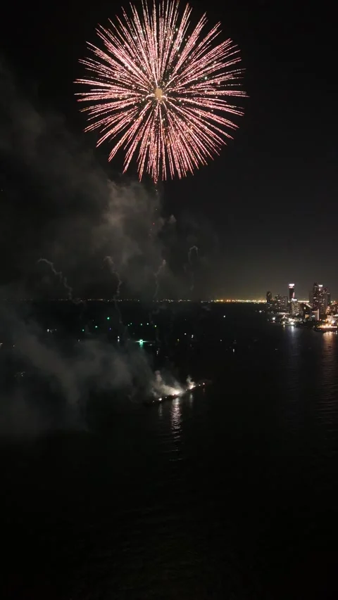 Firework Exploding Over Pattaya Waterfront at Night, Thailand Stock Footage 335844332