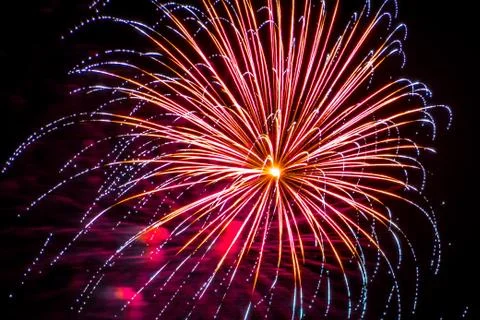 Firework fireworks celebration blue spikes red purple yellow Stock Photos
