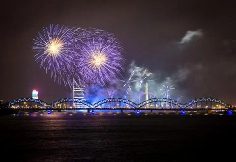 Firework in Riga over the river with bridge Stock Photos