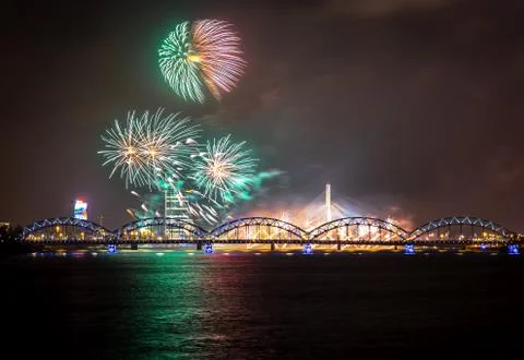 Firework in Riga over the river with bridge Stock Photos