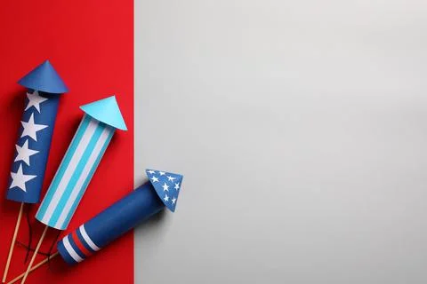 Firework rockets on color background, flat lay with space for text. Festive d Stock Photos