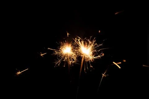 Firework sparkler burning, Bengal fire on black background, burning sparklers Stock Photos