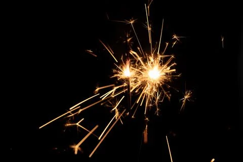 Firework sparkler burning, Bengal fire on black background, burning sparklers Stock Photos