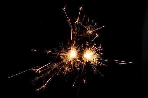 Firework sparkler burning, Bengal fire on black background, burning sparklers Stock Photos