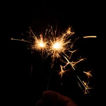 Firework sparkler burning, Bengal fire on black background, burning sparklers Stock Photos