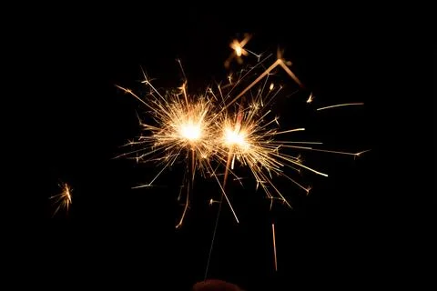 Firework sparkler burning, Bengal fire on black background, burning sparklers Stock Photos