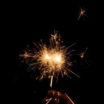 Firework sparkler burning, Bengal fire on black background, burning sparklers Stock Photos