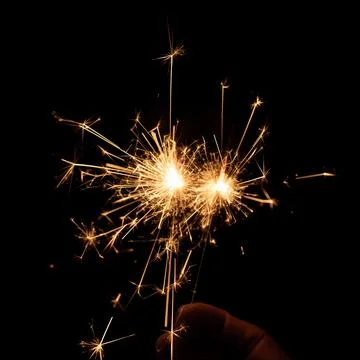 Firework sparkler burning, Bengal fire on black background, burning sparklers Stock Photos