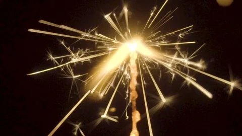 Firework sparkler burning on black background in slow motion Stock Footage 85462923