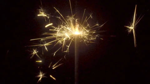 Firework sparkler burning on black background Stock Footage 86201234