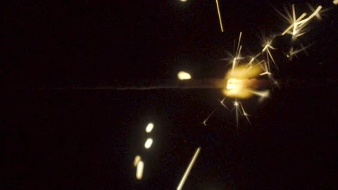 Firework sparkler burning on black background in slow motion Stock Footage 86201702