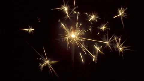 Firework sparkler burning on black background Stock Footage 86209209