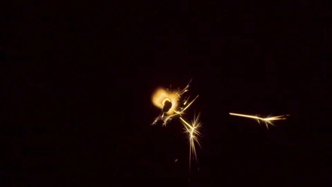 Firework sparkler burning on black background Stock Footage 86232684