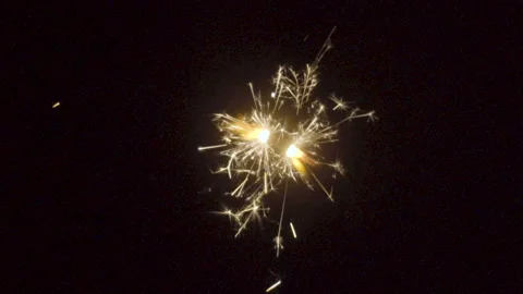 Firework sparkler burning on black background in slow motion Stock Footage 86232981