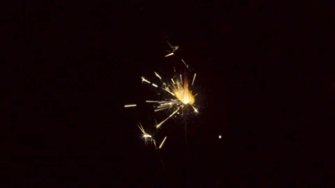 Firework sparkler burning on black background in slow motion Stock Footage 86233441