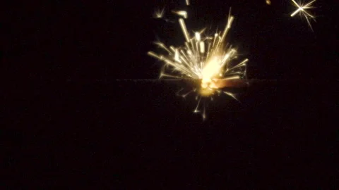 Firework sparkler burning on black background in slow motion Stock Footage 86234106